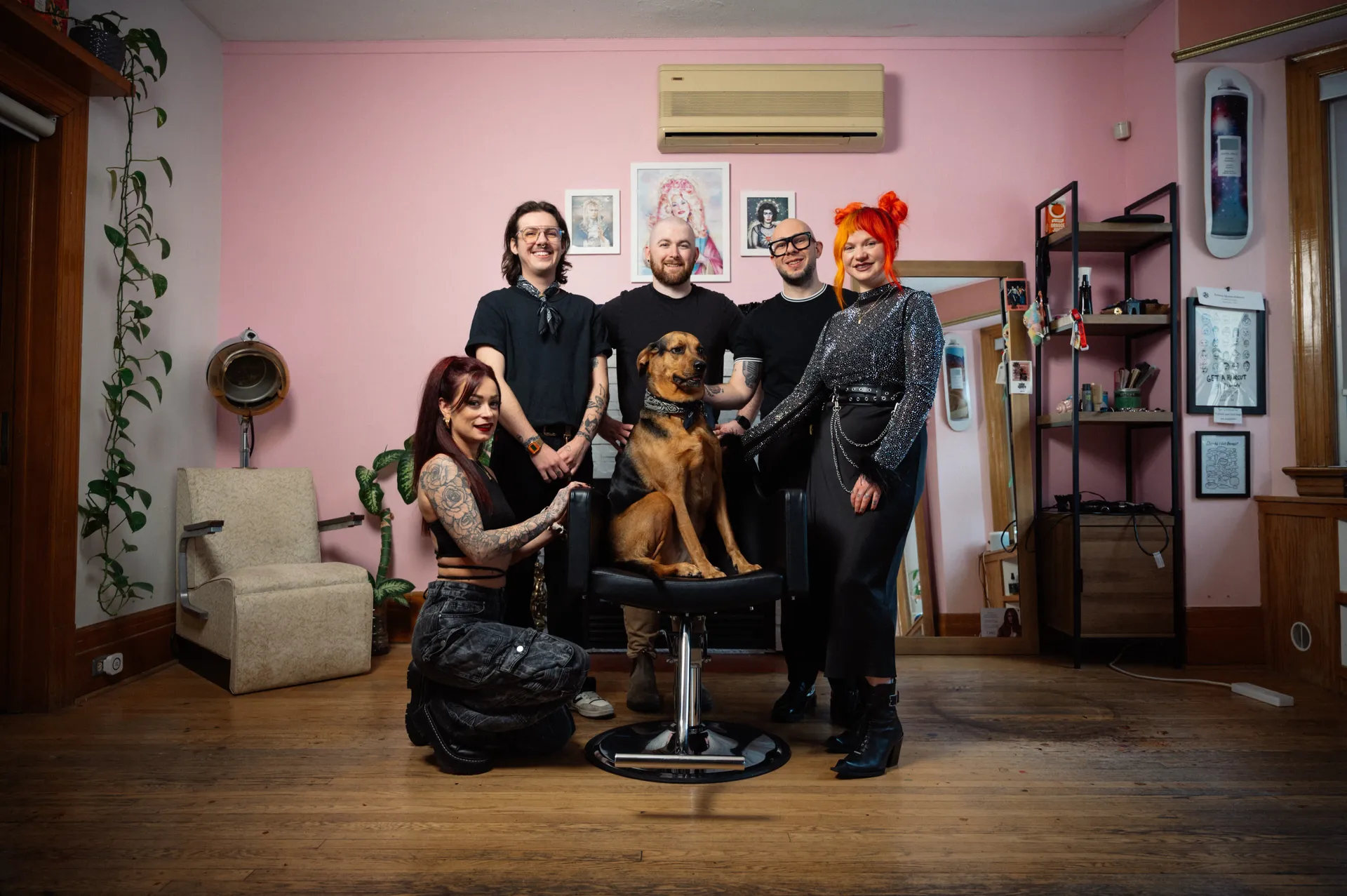 The Collective Haus gang huddles around Marge for a team profile photo.